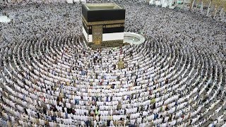 Thousands of Muslim worshippers perform prayers around the Kaaba [upl. by Loferski227]