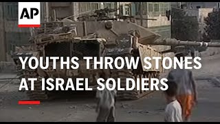 Youths throw stones at Israel soldiers [upl. by Lierbag278]